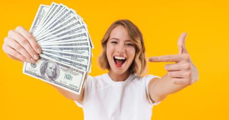 Happy woman with cash