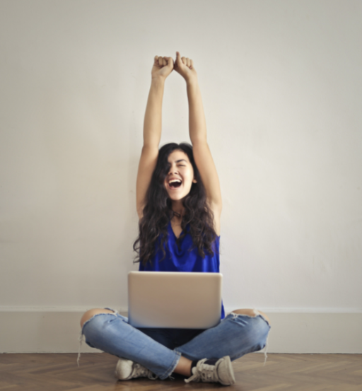 Happy girl using laptop