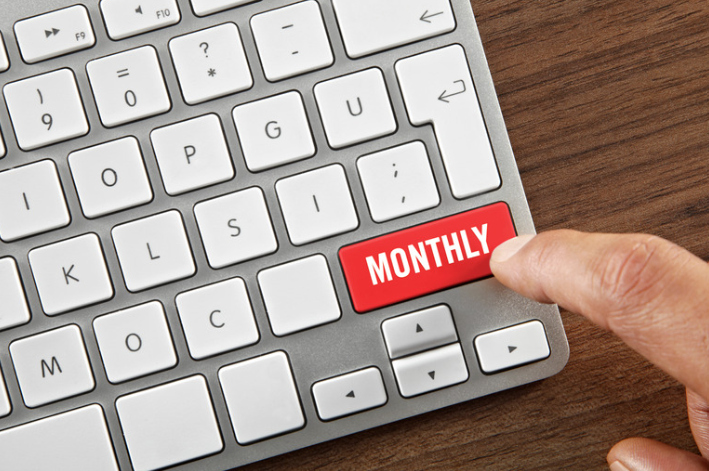 Laptop keyboard with a key that says Monthly 